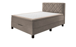 Boxspringbett Josh aus einem Mikrofaser Bezug in Beige mit schwarzen Füßen.