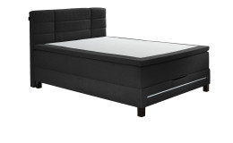Boxspringbett Jogi in Anthrazit aus einem Stoffbezug mit einer Lichtleiste im Fußteil.