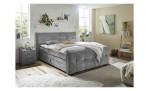 Boxspringbett Kasper in einem Raum stehend