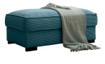 Hocker Holly in einem Türkisblauen Cordstoff bezoegn.