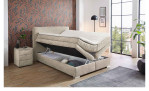 Boxspringbett Alice in der Farbe Beige im Schlafzimmer mit geöffneten Bettkästen