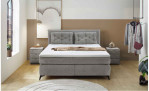 Boxspringbett Cher in der Farbe Grau in einem Zimmer