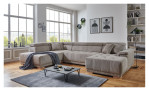 Komfort-Wohnlandschaft För in einem Cordbezugstoff in Taupe. Auf einem dekorierten Hintergrund