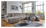 Komfort-Wohnlandschaft För in einem Cordbezugstoff in Taupe. Auf einem dekorierten Hintergrund