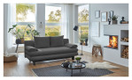 Schlafsofa Bill in Grau aus einem Breitcordbezug und schwarzen Füßen. Auf einem dekorierten Hintergrund.