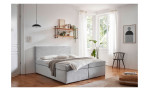 Boxspringbett Arutua in der Farbe silber, in einem Raum stehend