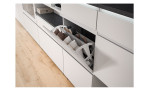 Schuhschrank Shoes mit 3 Klappen und 1 Schubkasten, in der Farbe Weiß und einem Oberboden in Industrial Grau, Detailansicht mit geöffneter Klappe